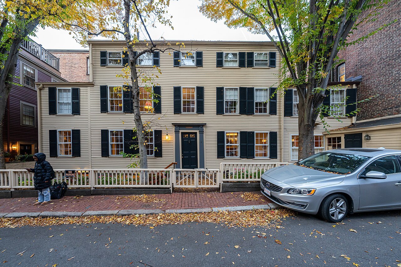 The William C. Nell House, a pale clapboard house with black shutters on Beacon Hill