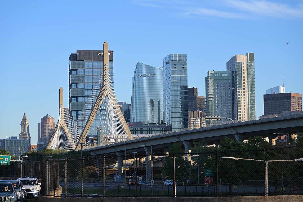 The white cables of the Zakim Bridge against the new towers by North Station, seen from Charlestown
