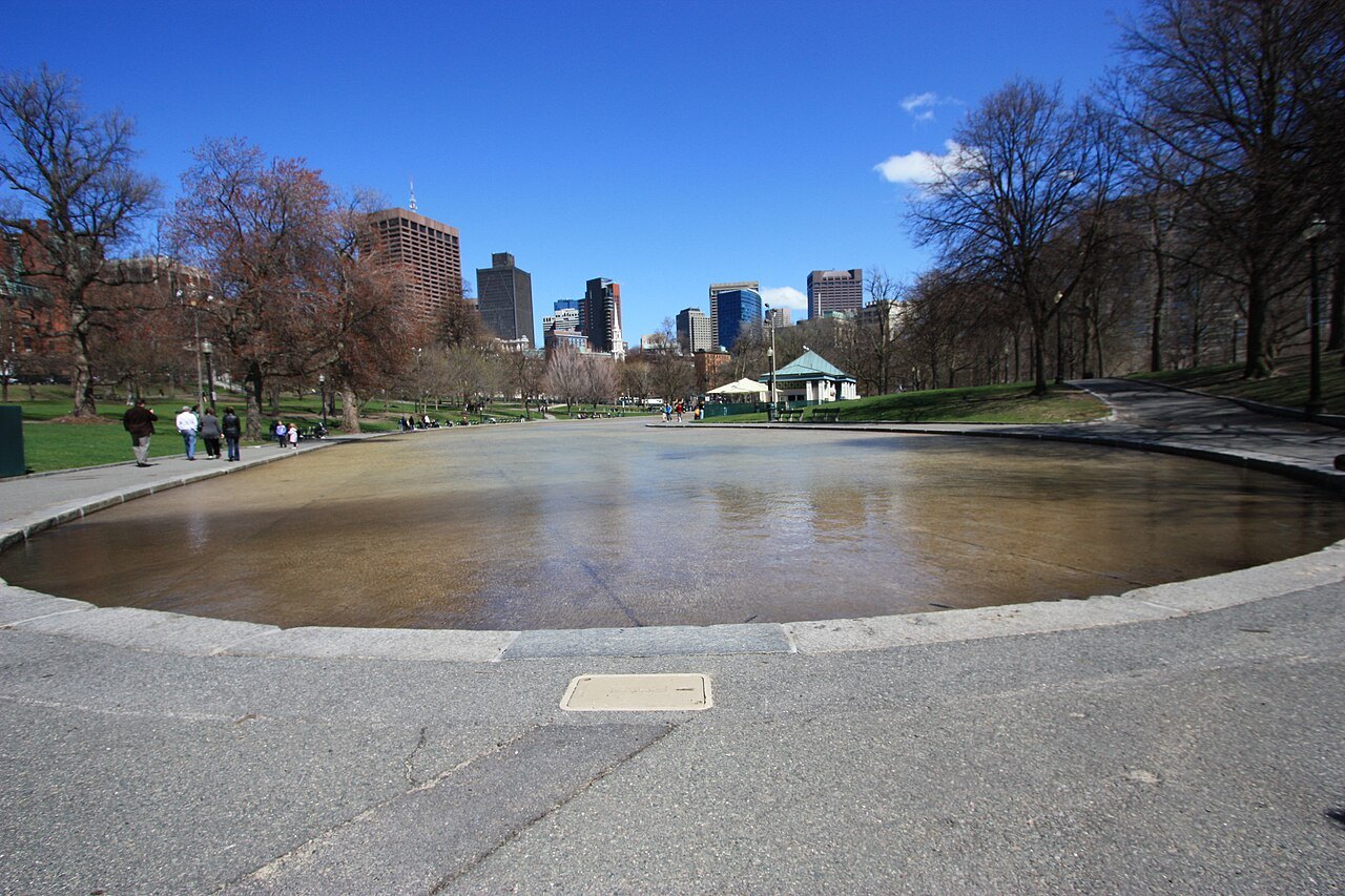 The Frog Pond on the Common emptied between seasons, its shallow basin ringed by paths