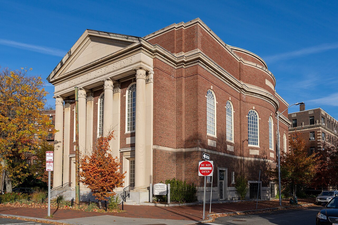 The columned front of the First Church of Christ, Scientist, among autumn trees