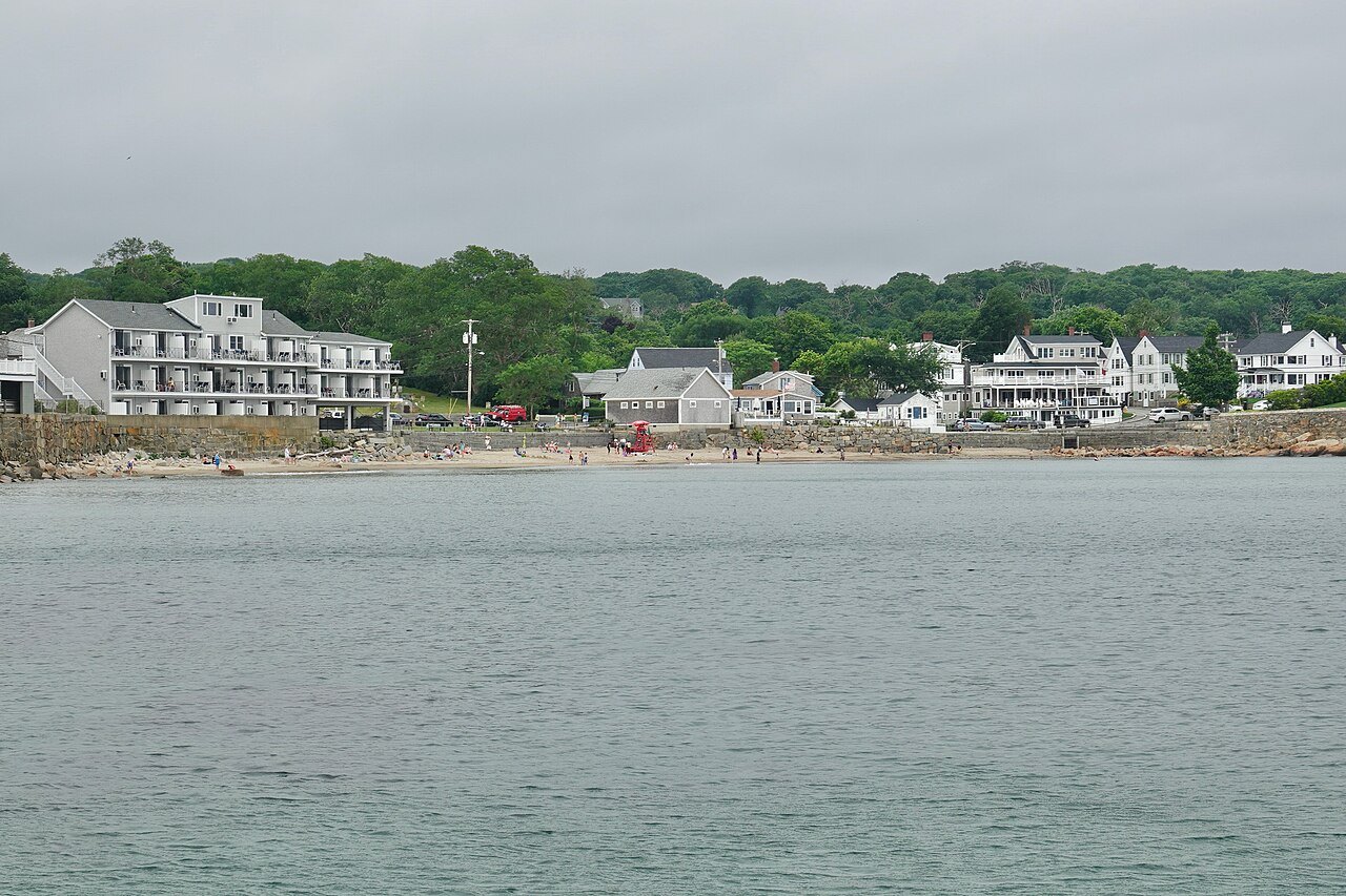 Front Beach in Rockport, the town's houses strung along the shore beyond the water