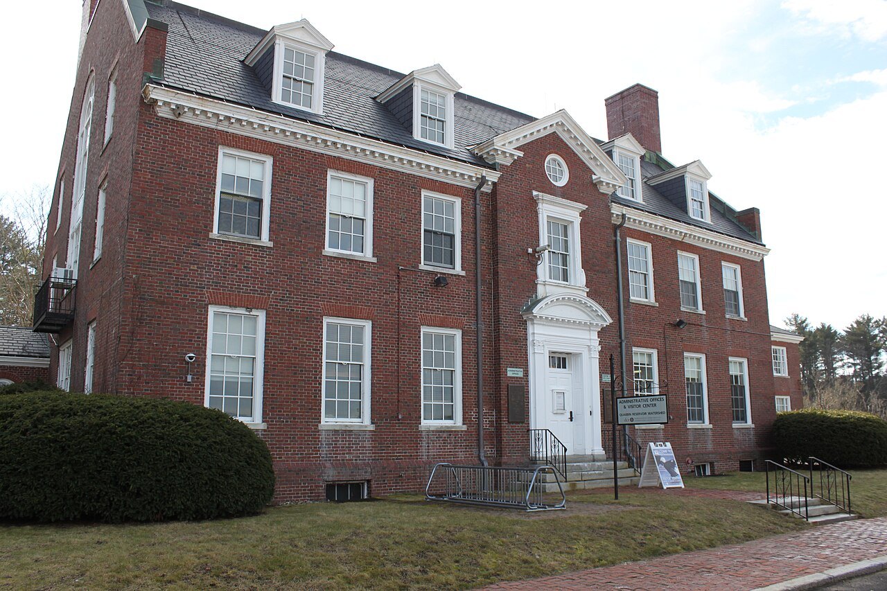 The brick Quabbin Visitor Center behind its green lawn