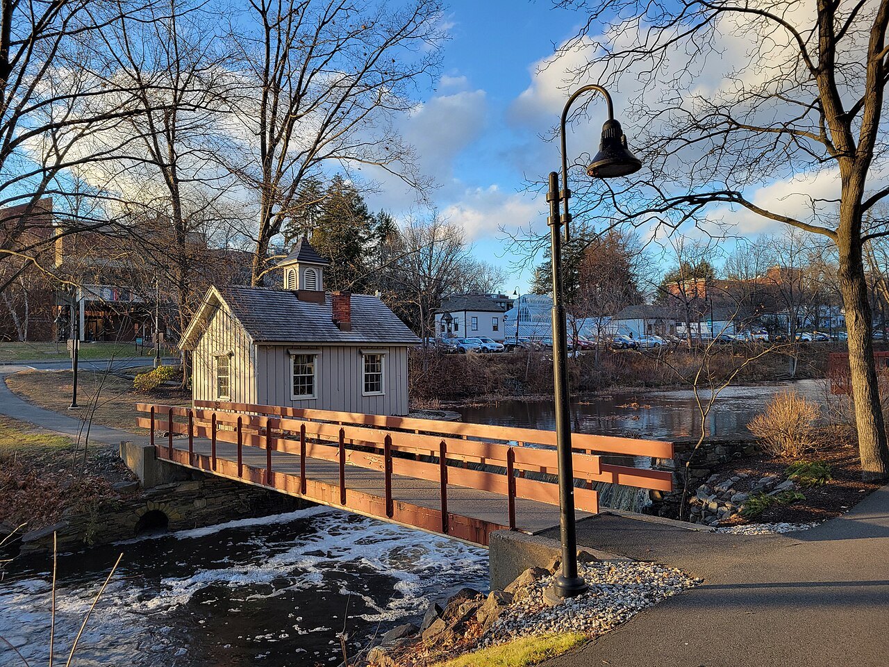 A small house and footbridge by the falls at Mount Holyoke College