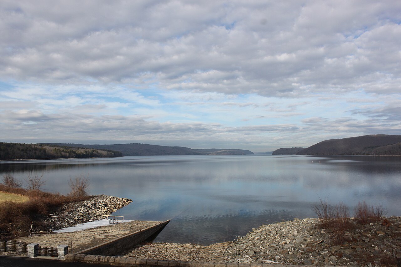 The broad Quabbin Reservoir under a quilted sky