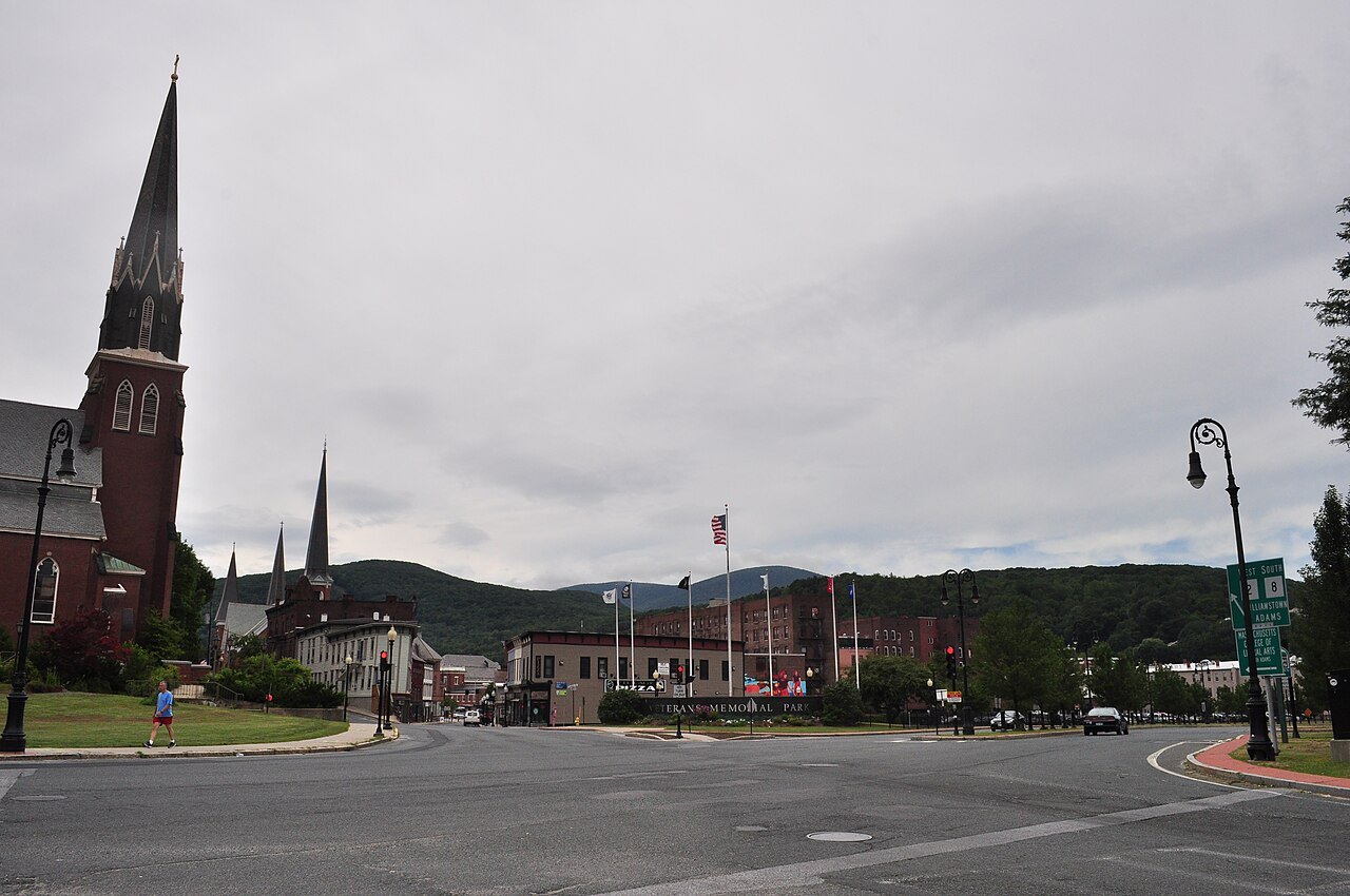Church spires and the hills around a North Adams street