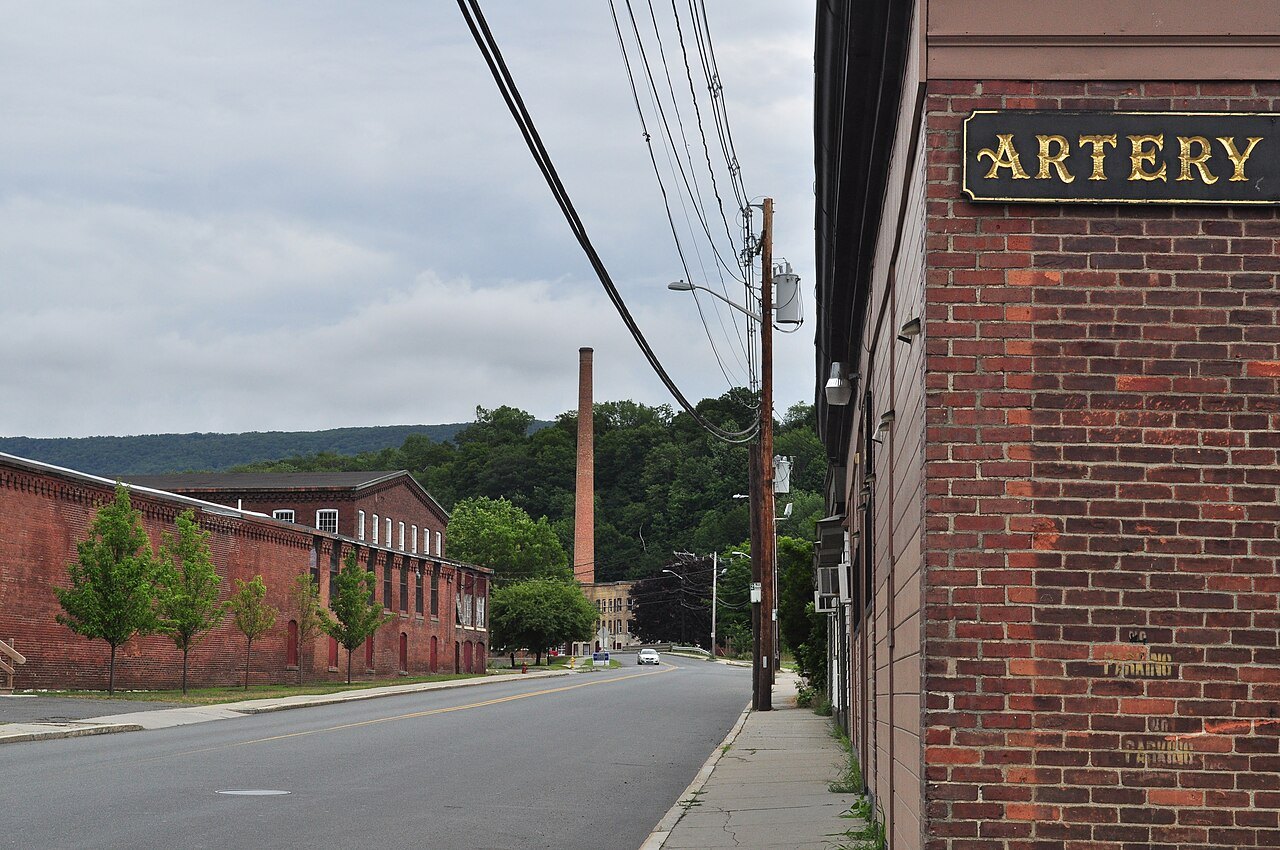 The Mohawk Trail heading east through North Adams past old brick mills