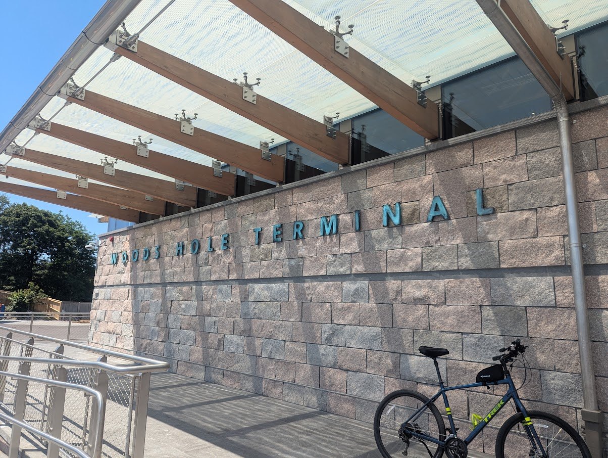 The stone wall and canopy of the ferry terminal at Woods Hole