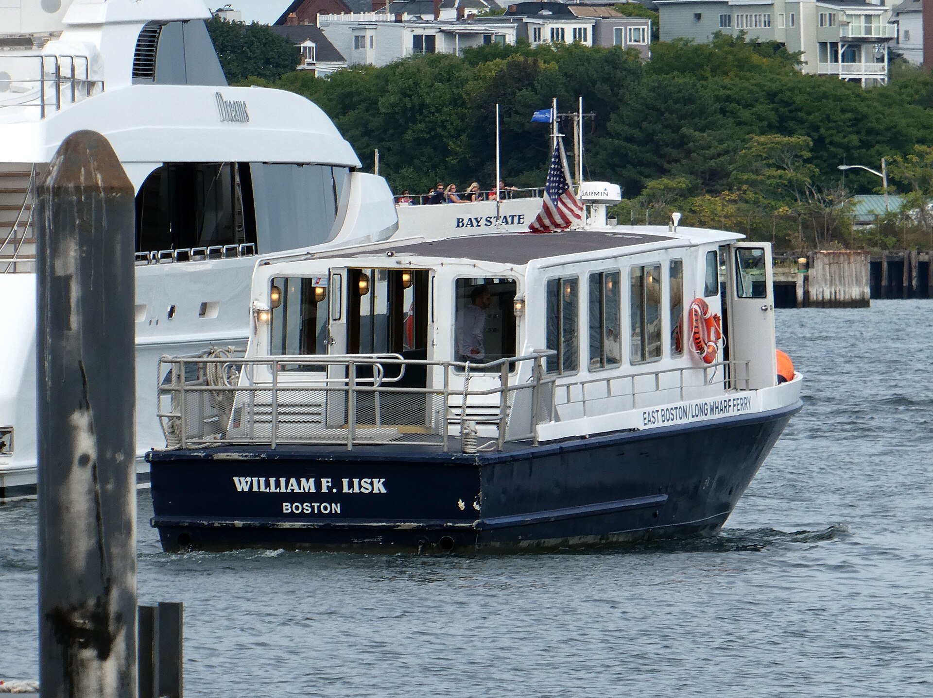 A small harbor ferry leaving Long Wharf for East Boston
