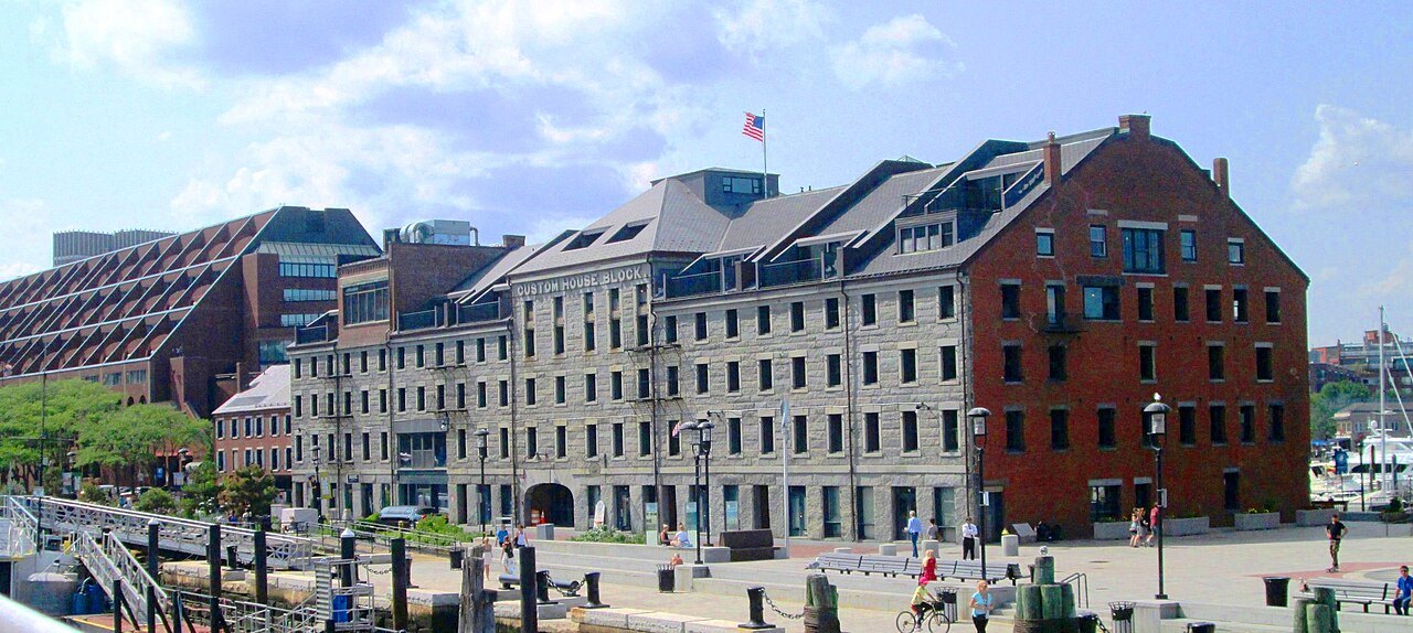 Long Wharf's granite warehouses on the Boston waterfront, seen from the harbor