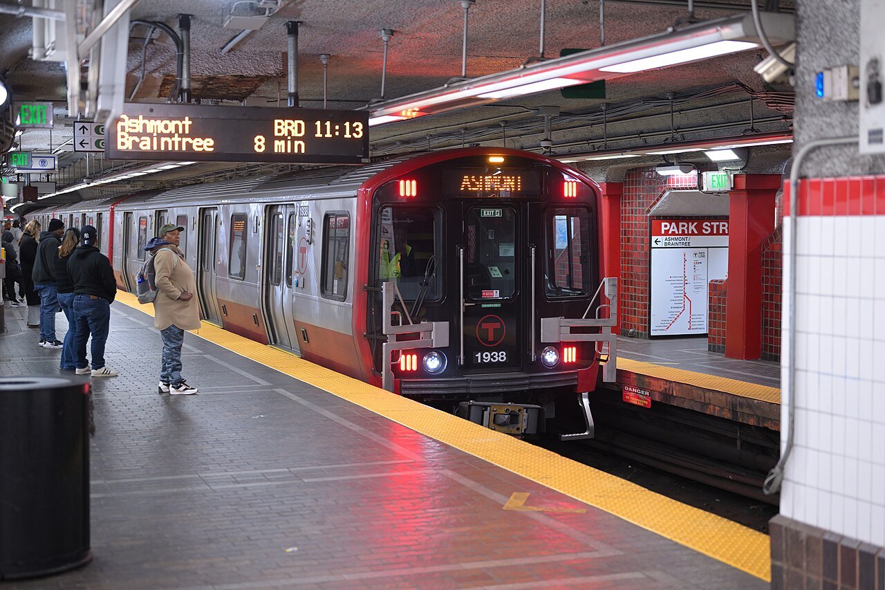 Passengers waiting as a Red Line train stands at Park Street