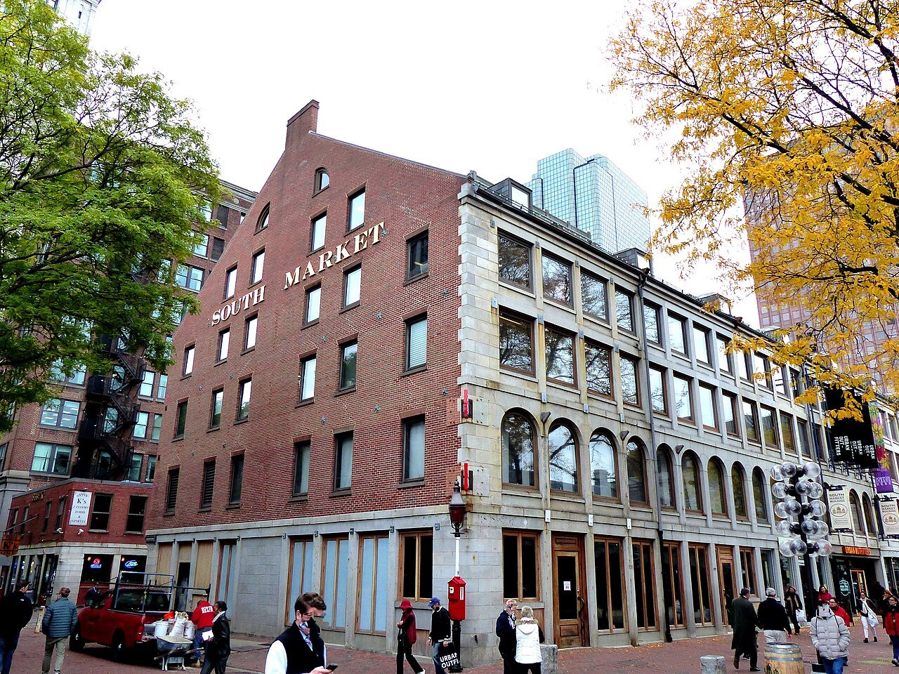 The South Market building in autumn, its name painted high on the brick