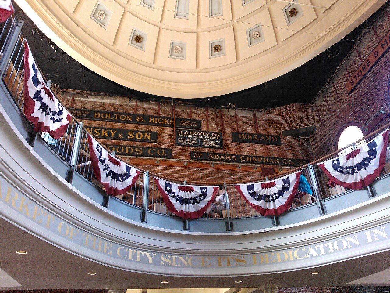 Inside the rotunda of Quincy Market, bunting hung beneath the painted dome