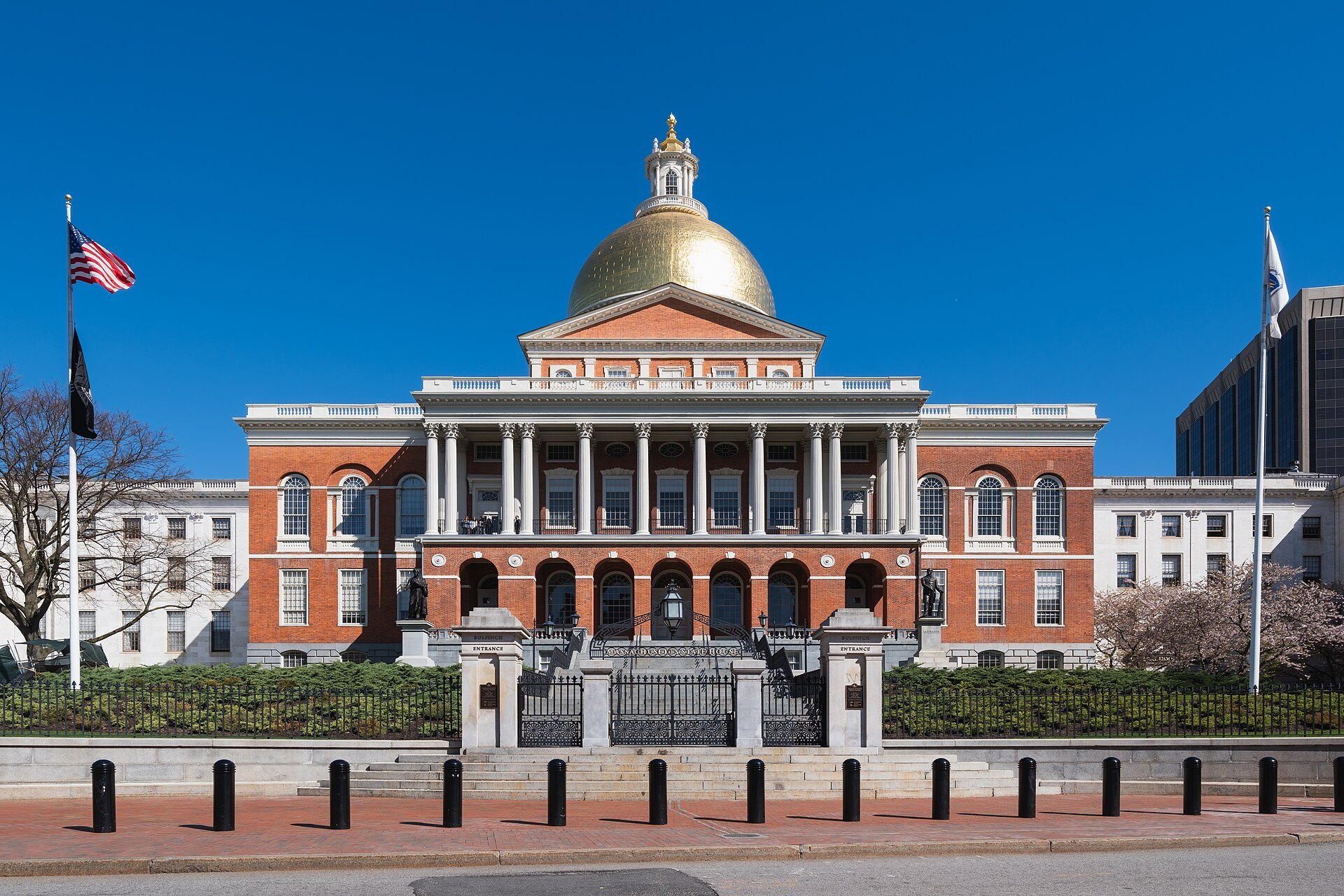 The Massachusetts State House on Beacon Street, its gold dome above the red-brick front and white portico