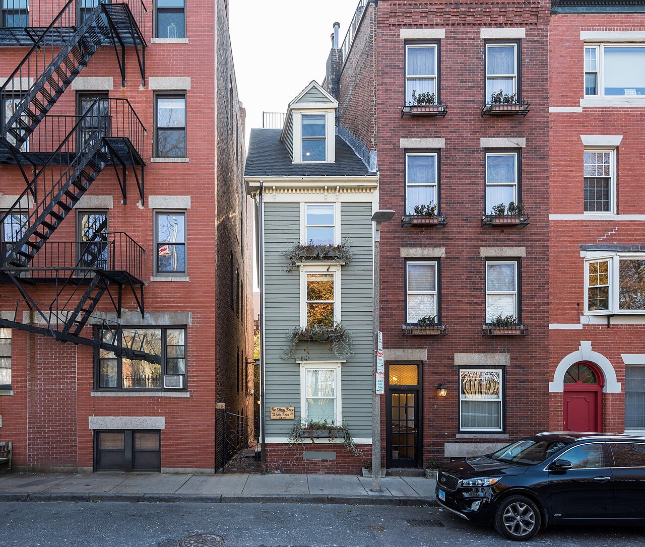 The narrow Skinny House on Hull Street, squeezed between brick walls in the North End