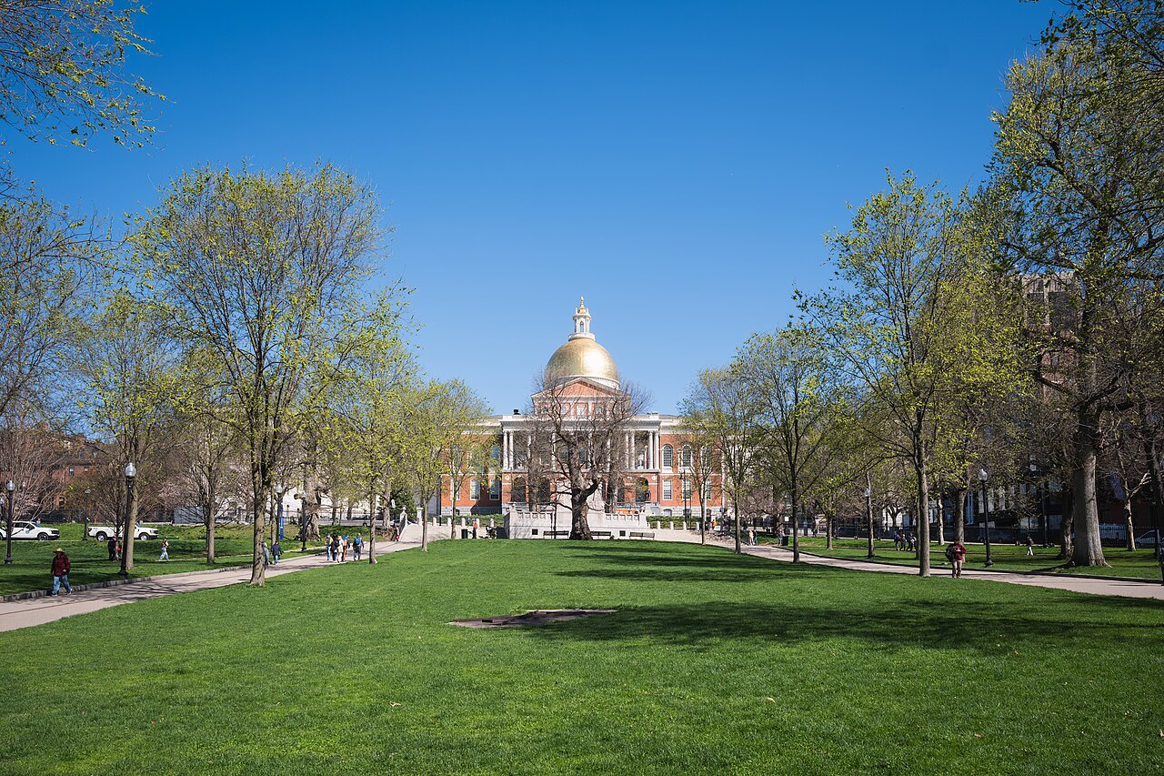 The State House dome seen across the spring lawns of Boston Common