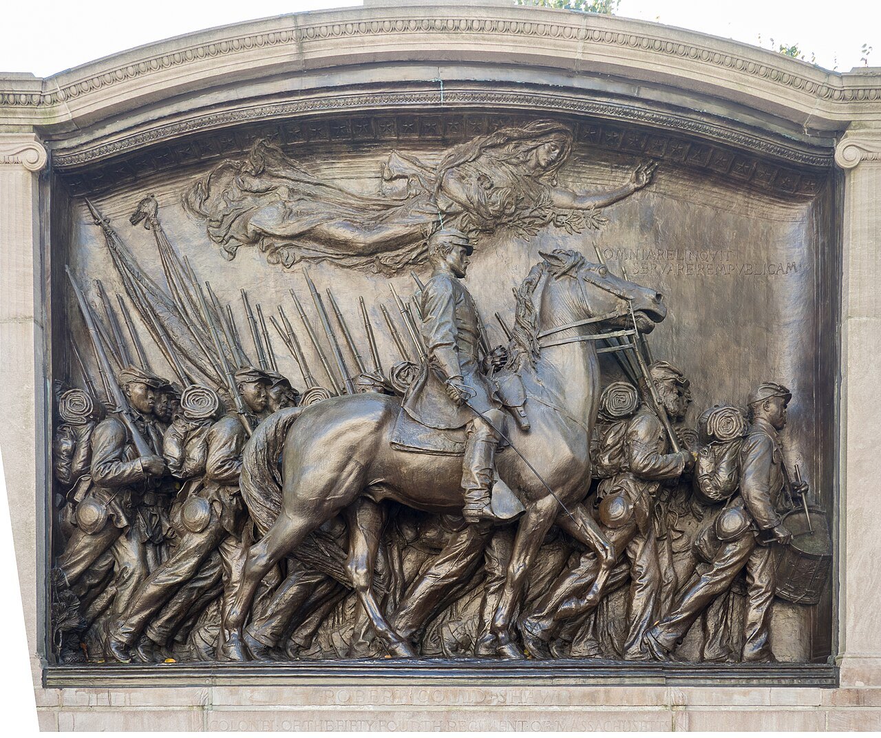 The bronze relief of the Robert Gould Shaw Memorial on Boston Common, facing the State House