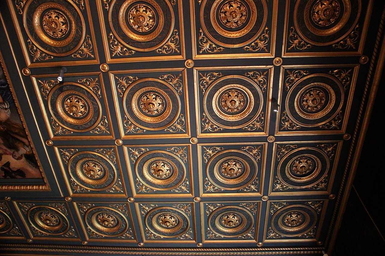 A carved and gilded coffered ceiling in one of the galleries