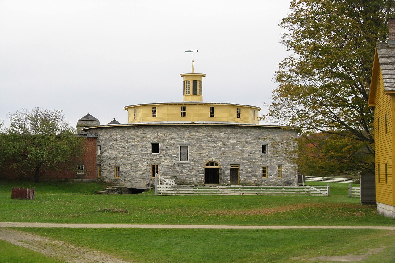The Round Stone Barn and its cupola across the village lawn