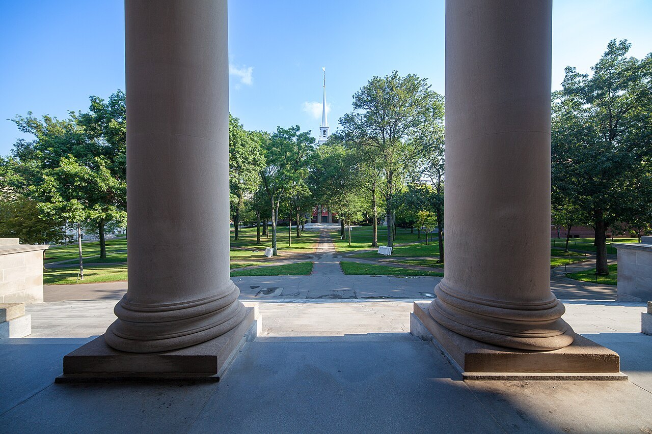 The Yard seen between the columns at the top of the Widener Library steps