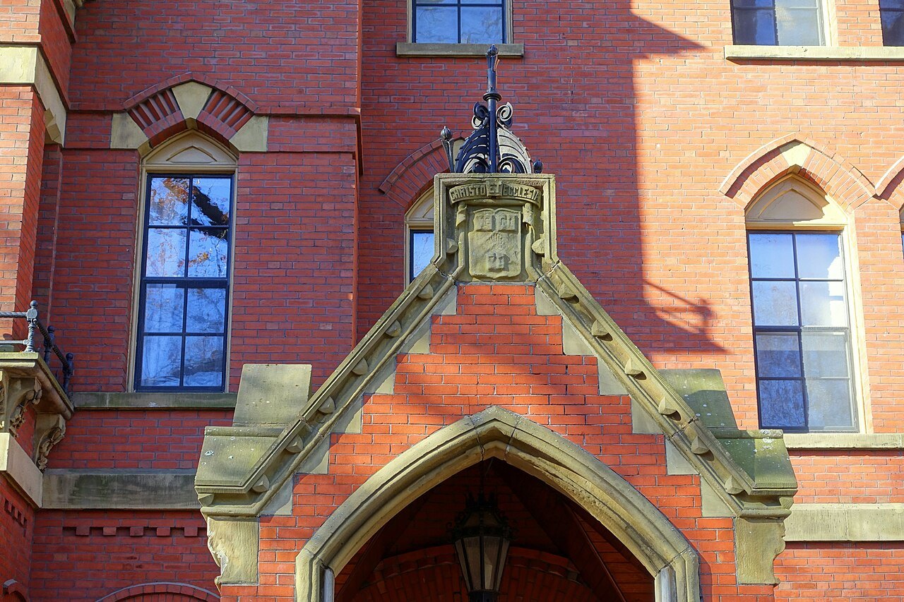 The carved stone entrance and red brick of Matthews Hall