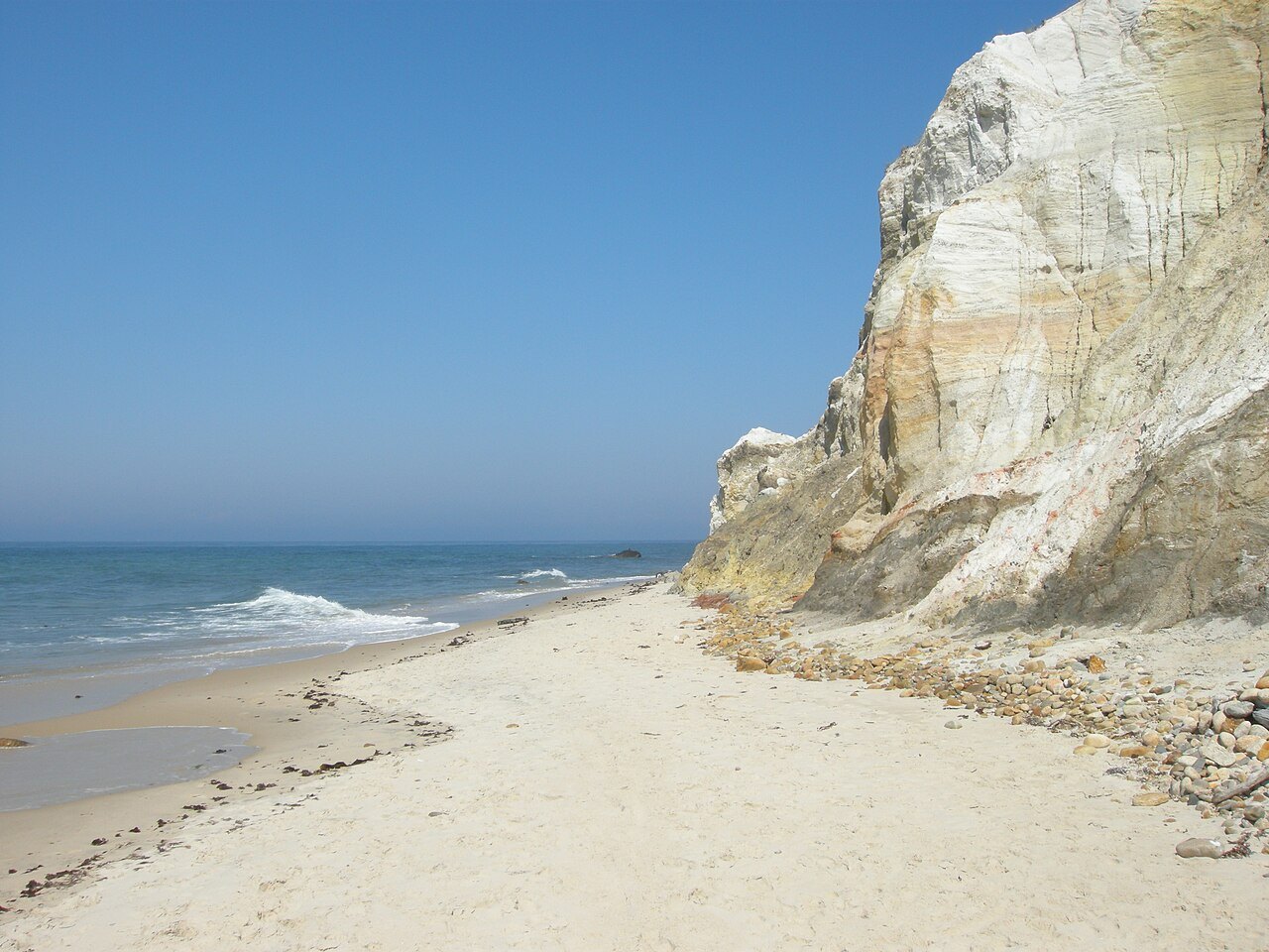 The beach beneath the Aquinnah cliffs, surf on the sand