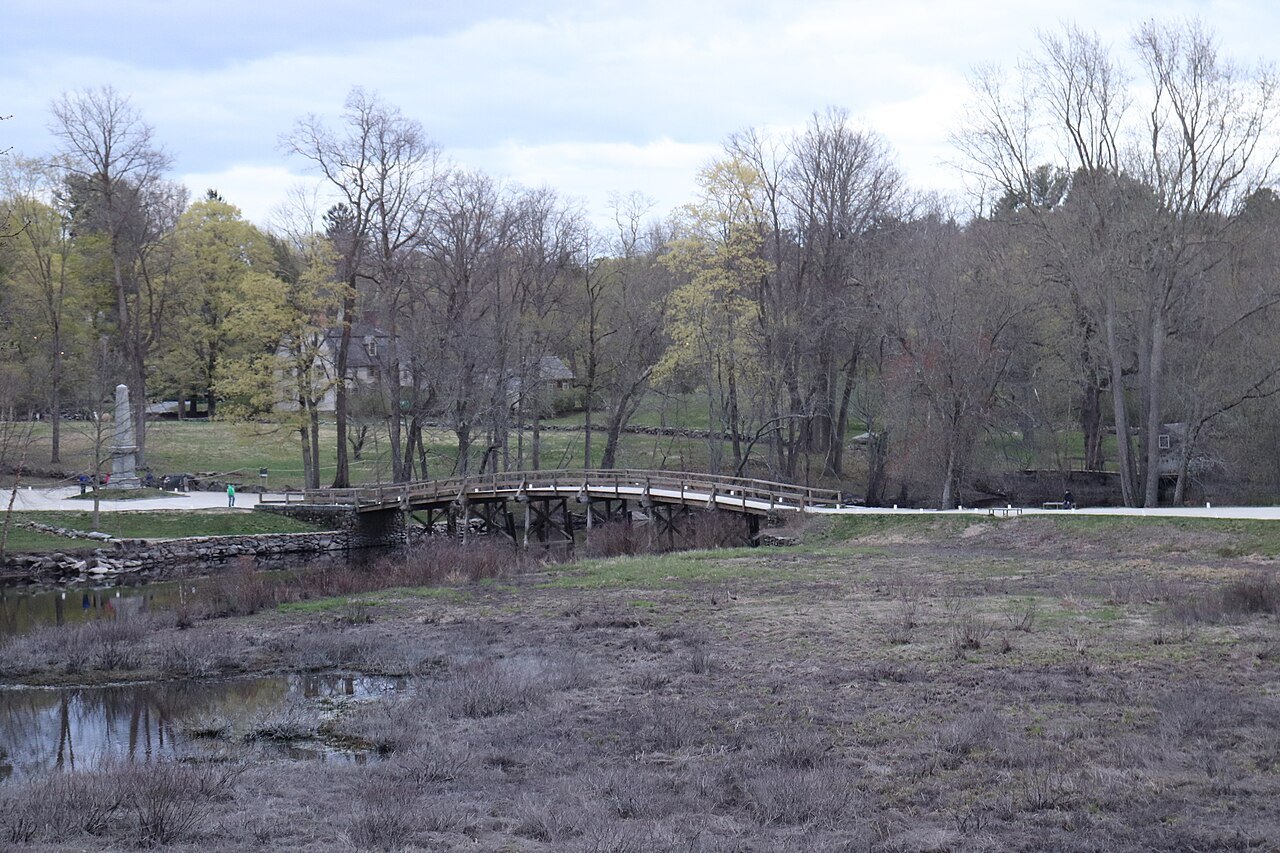The North Bridge and its meadow in early spring, from the overlook by the Buttrick gardens