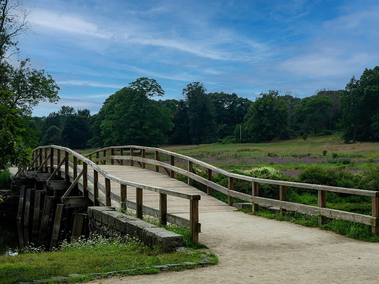 The path across the meadow to the North Bridge, lined by rail fences