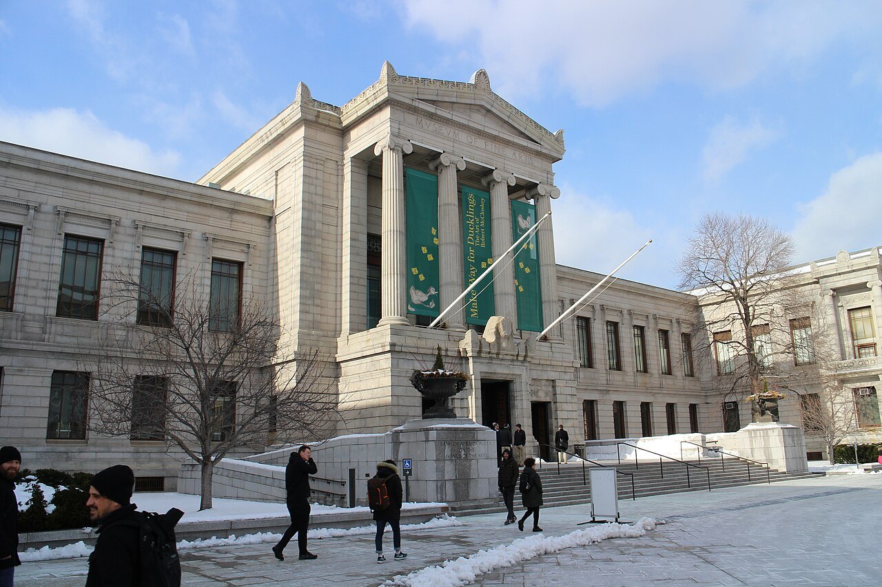 The portico of the Huntington Avenue front in low winter sun, visitors on the path