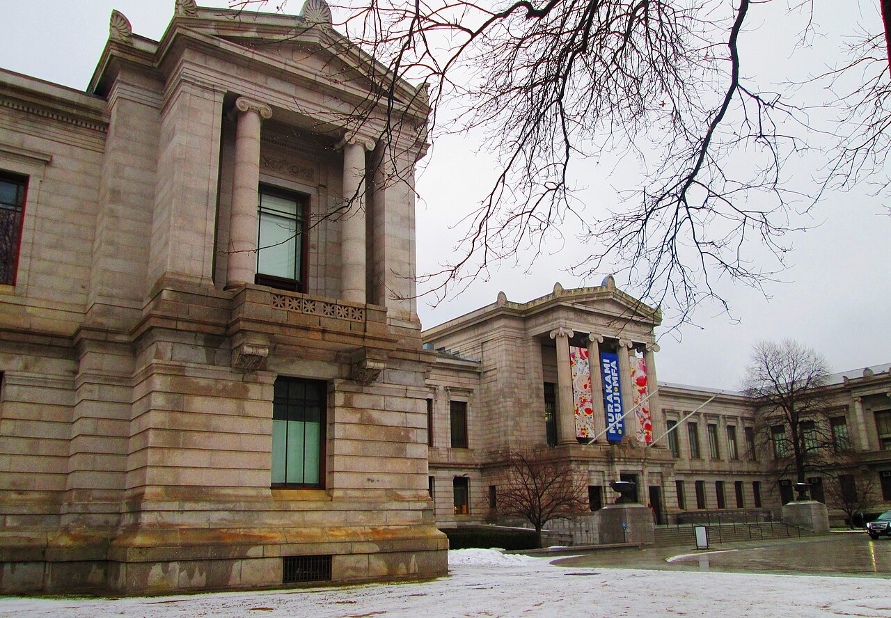 A corner pavilion of the museum's granite front on a snowy afternoon