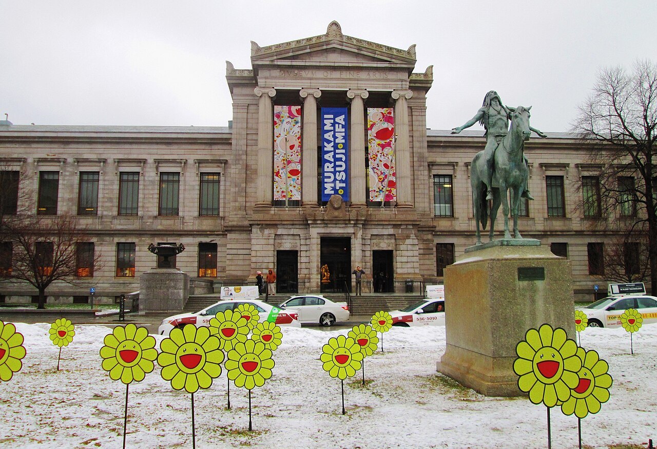 Bright flower sculptures dotting the snow of the front lawn in winter