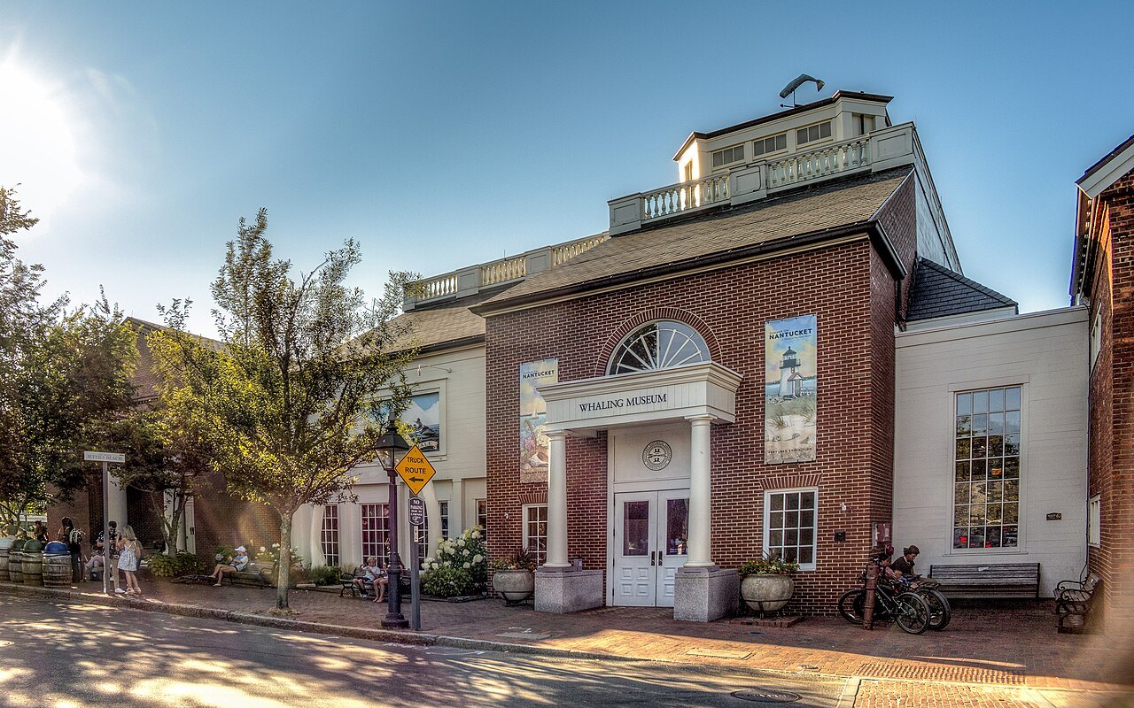 The brick front of the Nantucket Whaling Museum on a bright day