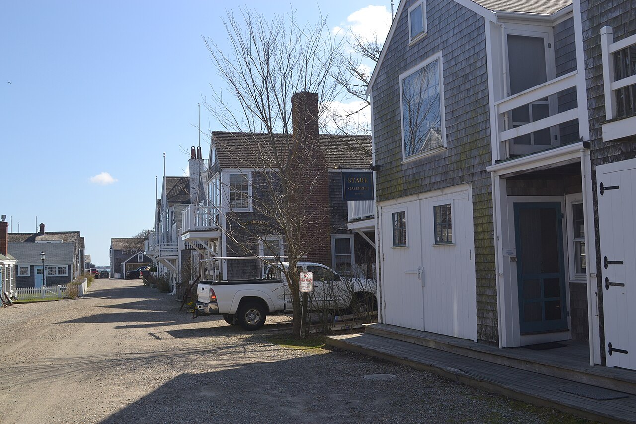 A quiet street of gray-shingled houses in the town of Nantucket