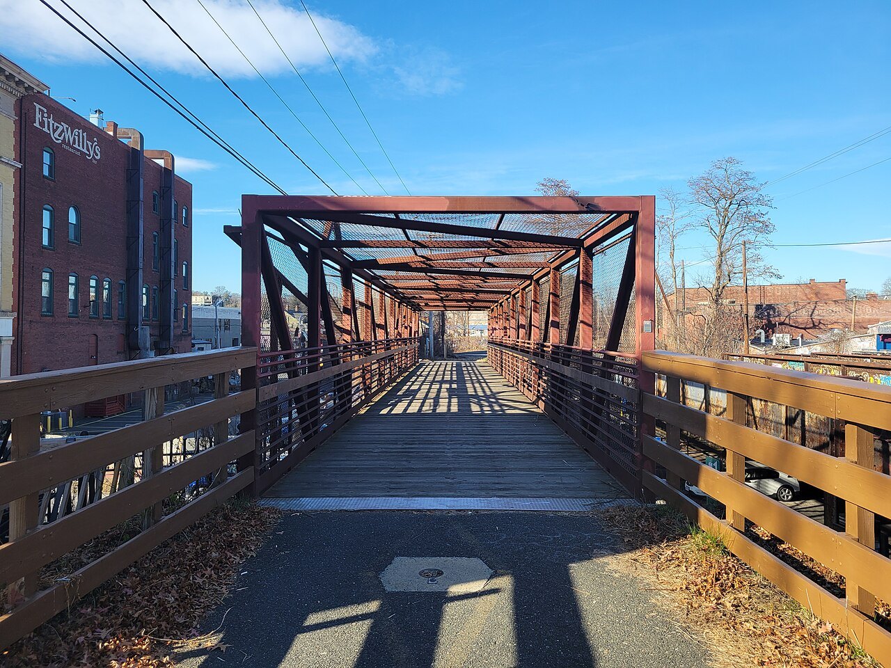 The rail trail's red steel truss bridge over Route 9