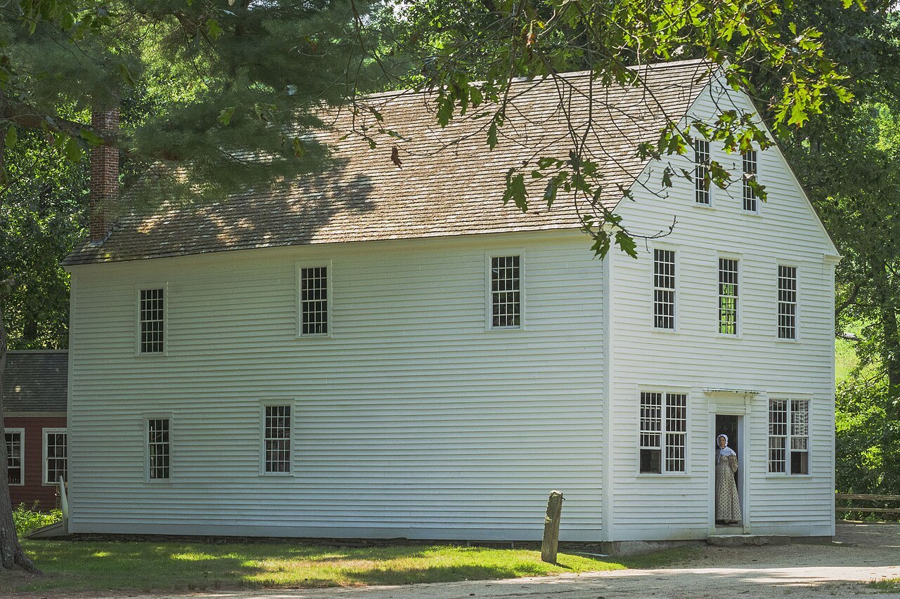 The Asa Knight Store, a tall white clapboard store under the pines