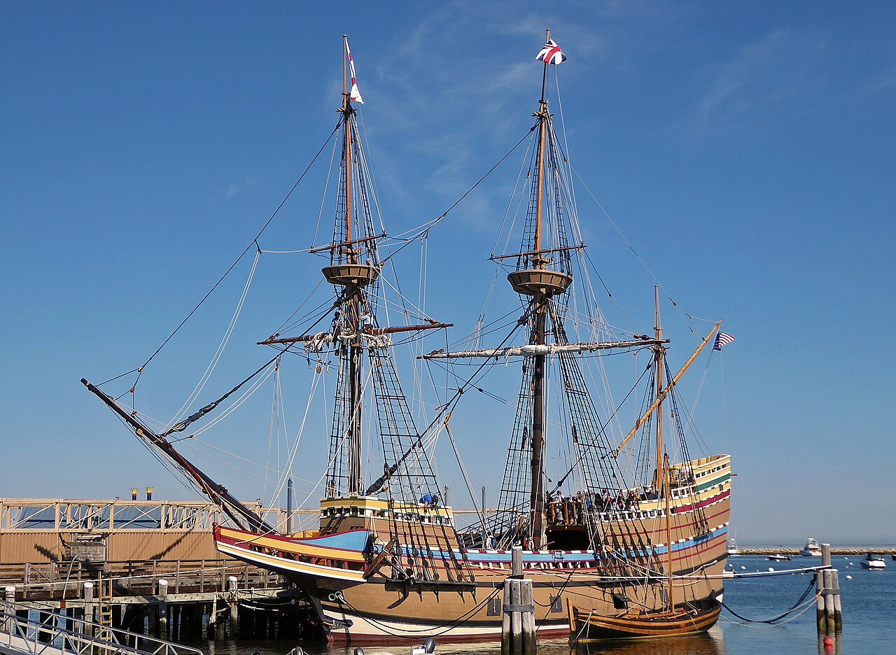 The Mayflower II at her berth on the Plymouth waterfront, flags flying