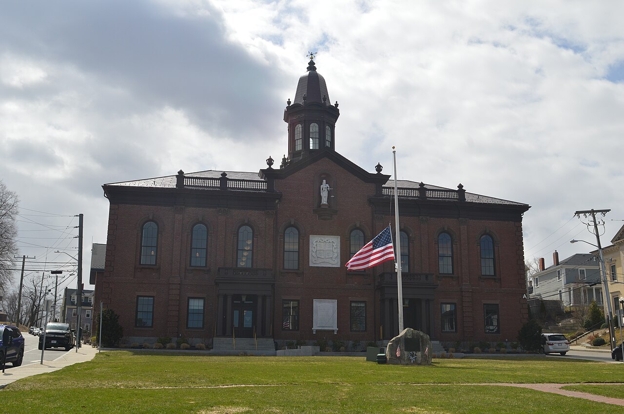 The old brick Town Hall of Plymouth, a flag flying before it