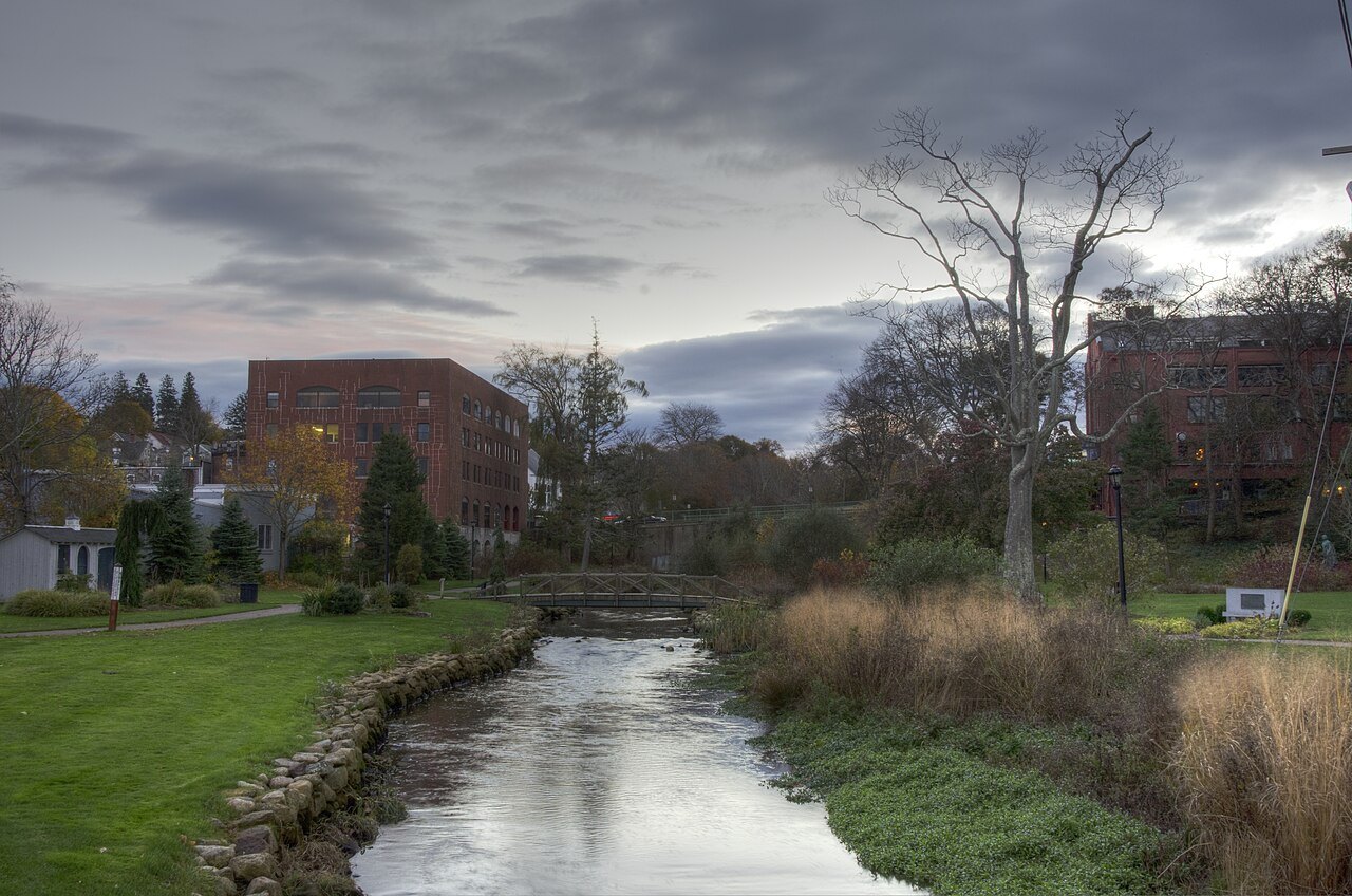 A brook running through a green park in the center of town