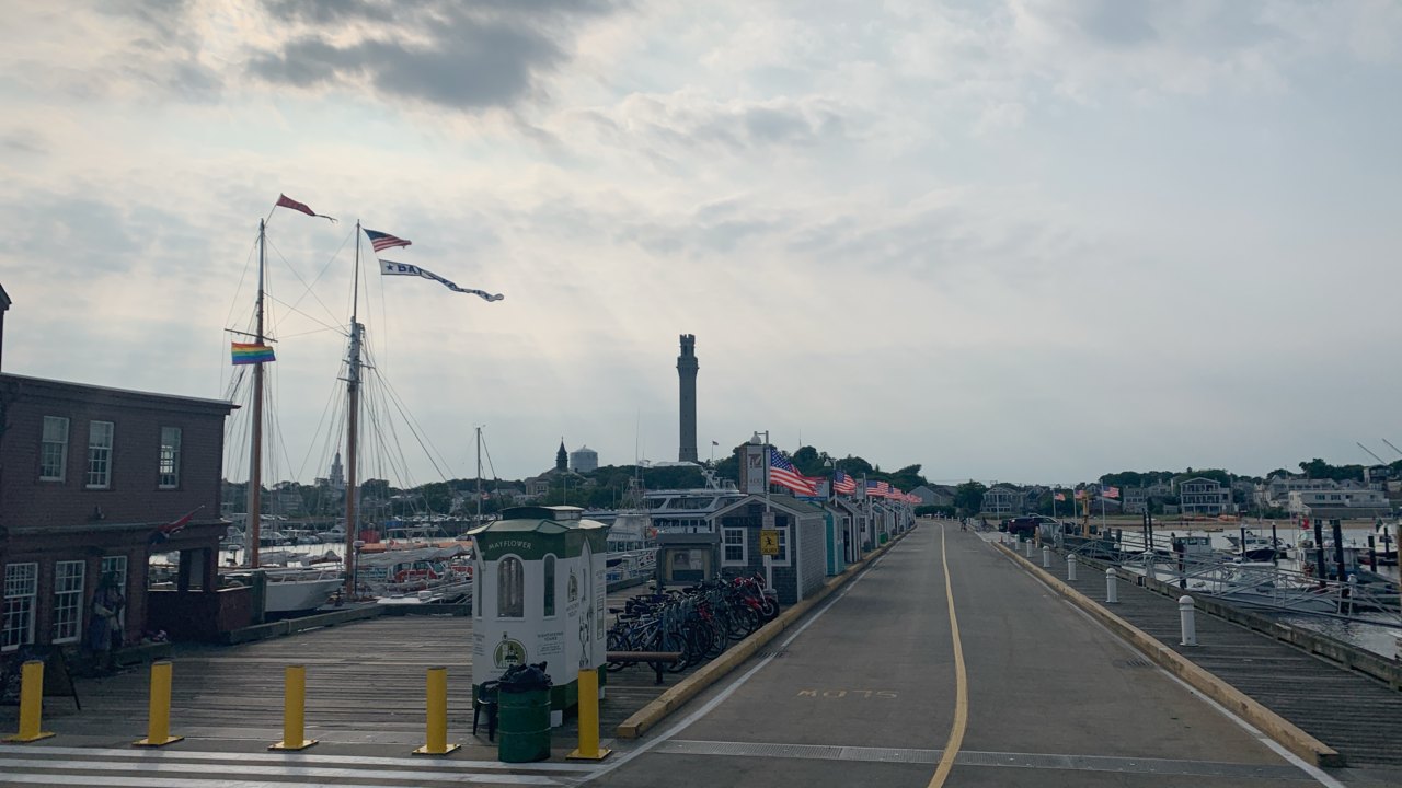 The pier at evening, the Pilgrim Monument on the skyline beyond