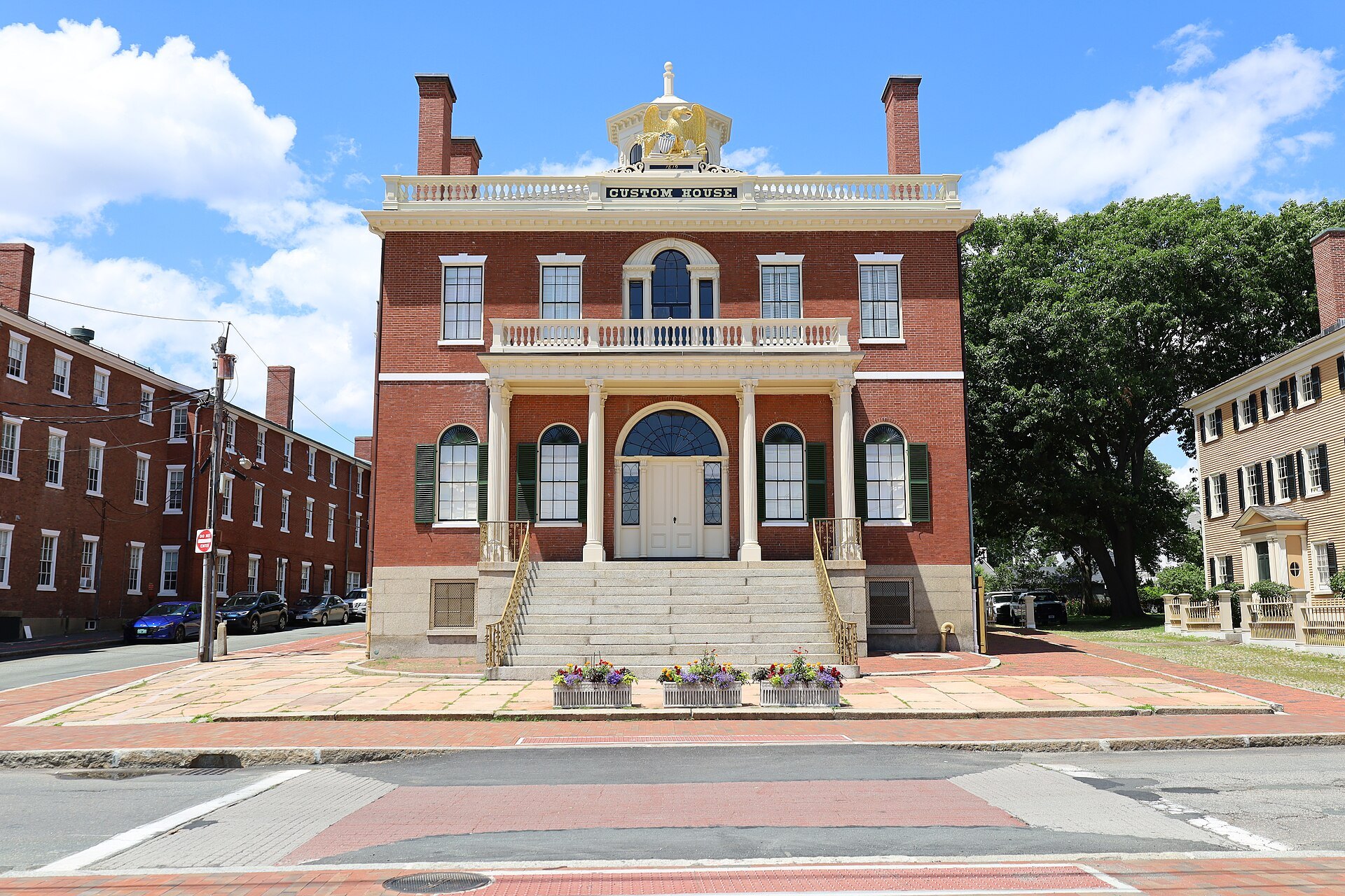 The Custom House at Salem Maritime, a gilded eagle above its brick front and white portico
