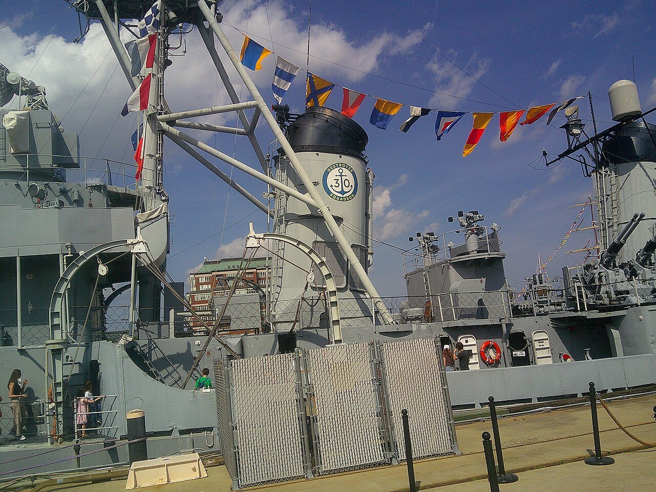 The destroyer USS Cassin Young dressed with signal flags at the Navy Yard