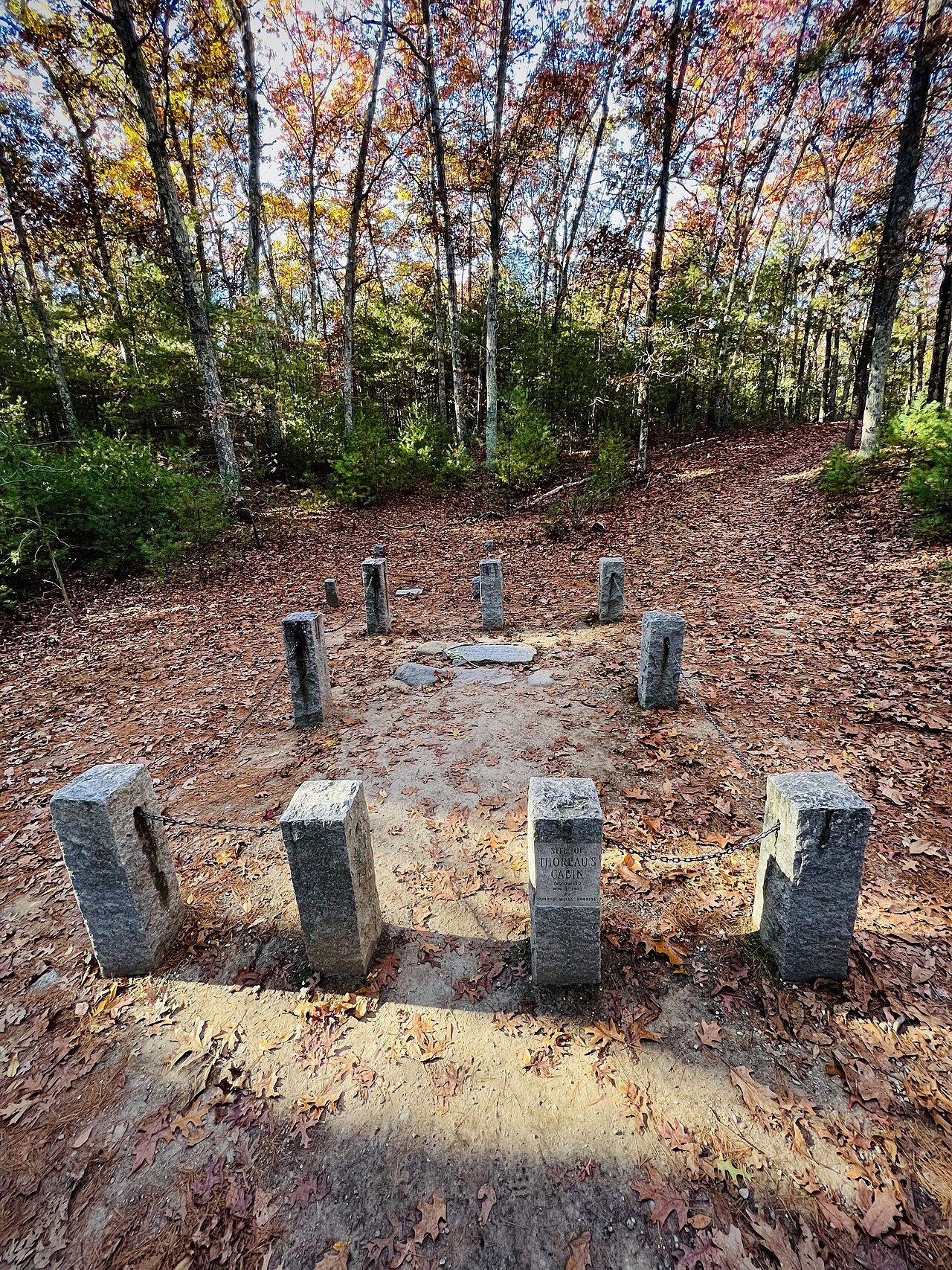 Granite posts marking the site of Thoreau's cabin among autumn trees